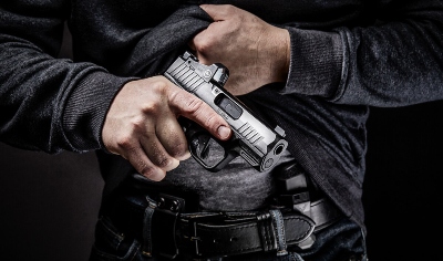 when is it illegal to carry a firearm in florida